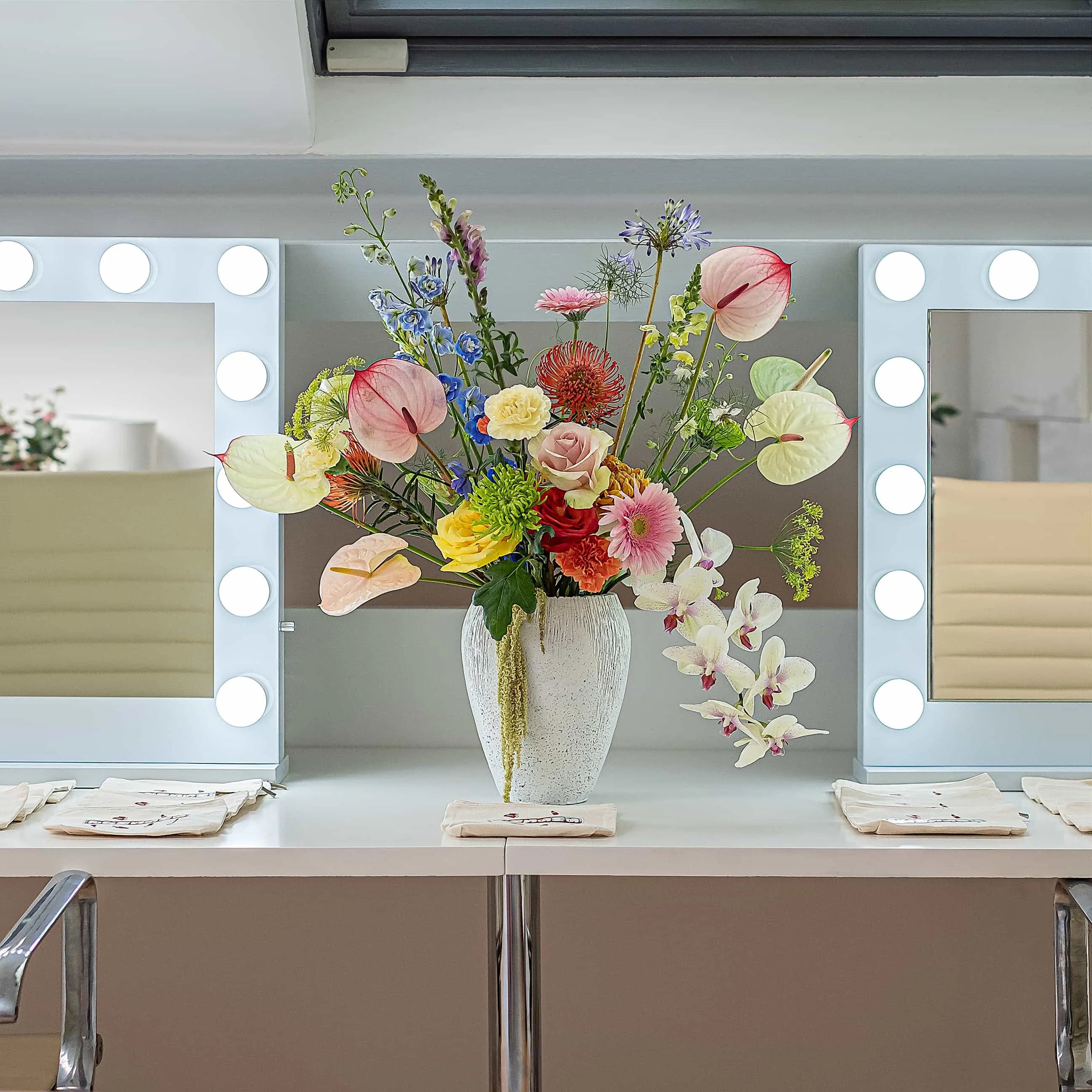 A beautiful, colourful floral vase arrangement created by event florist Amaranté London for a client for an influencer event