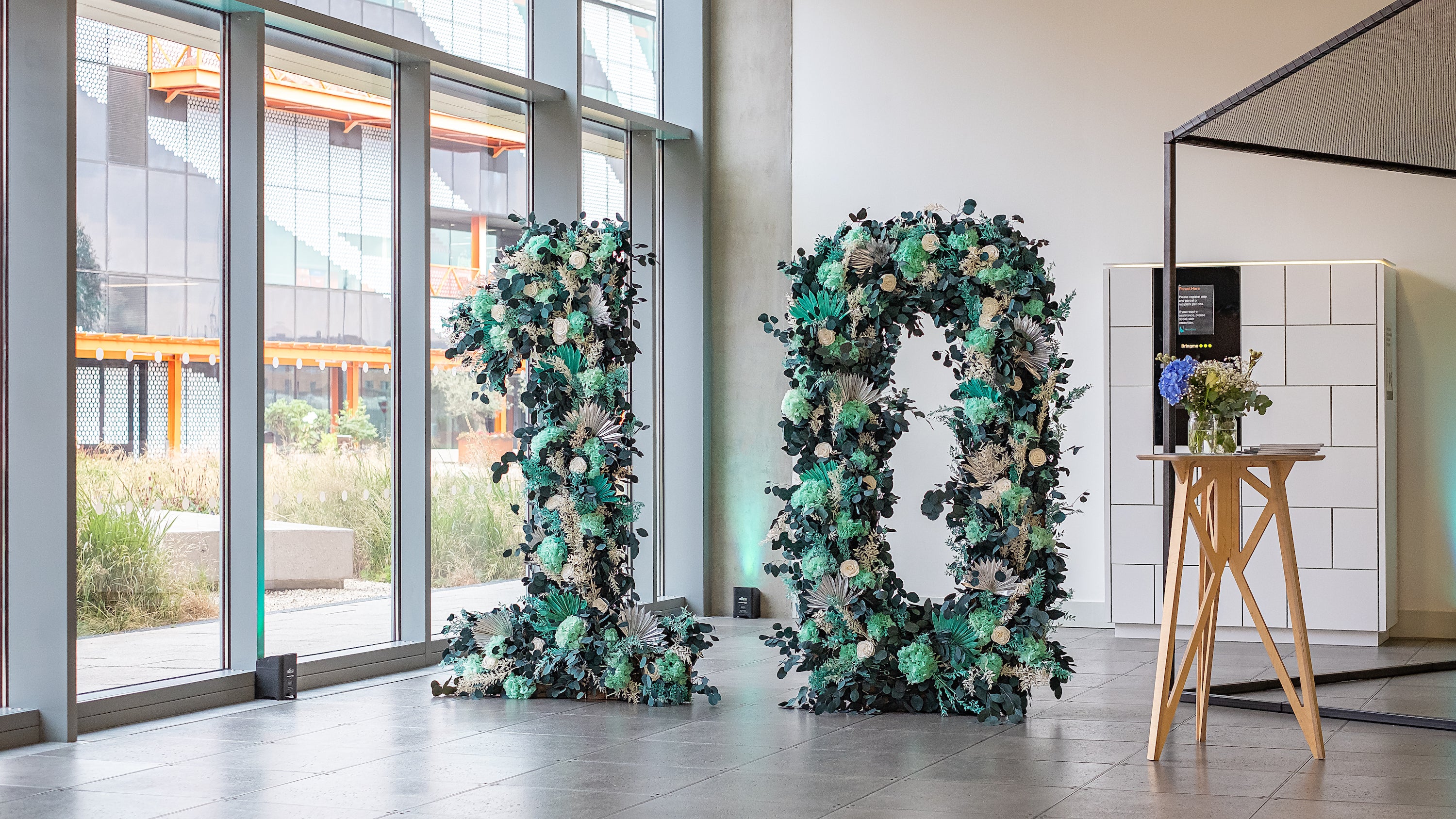 A bespoke floral installation was created using sustainable green stems especially for Here East’s anniversary celebration event by an event florist.