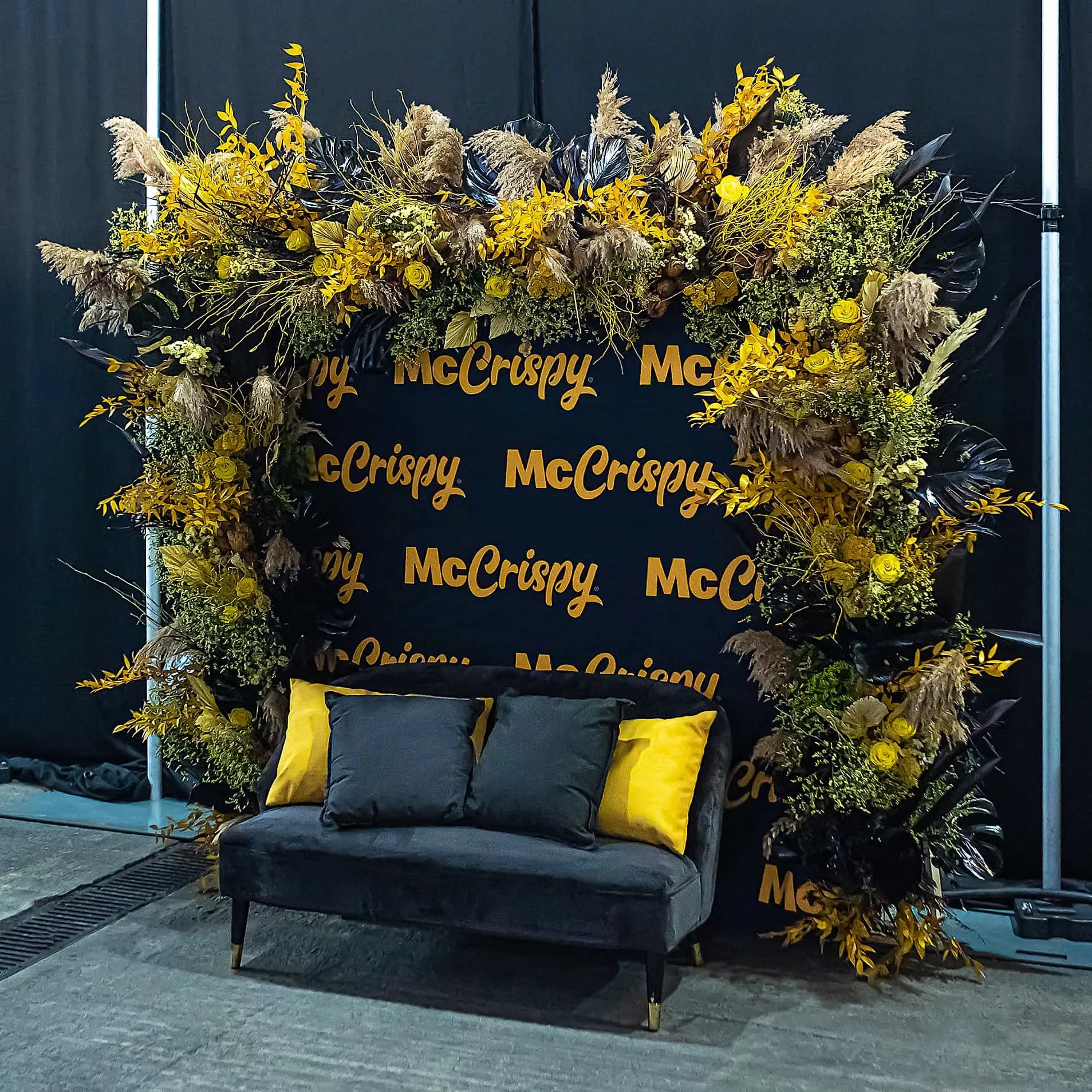 Curated using their signature brand colours, event florist Amaranté London brought together sustainable stems to make a floral arch installation for McDonalds
