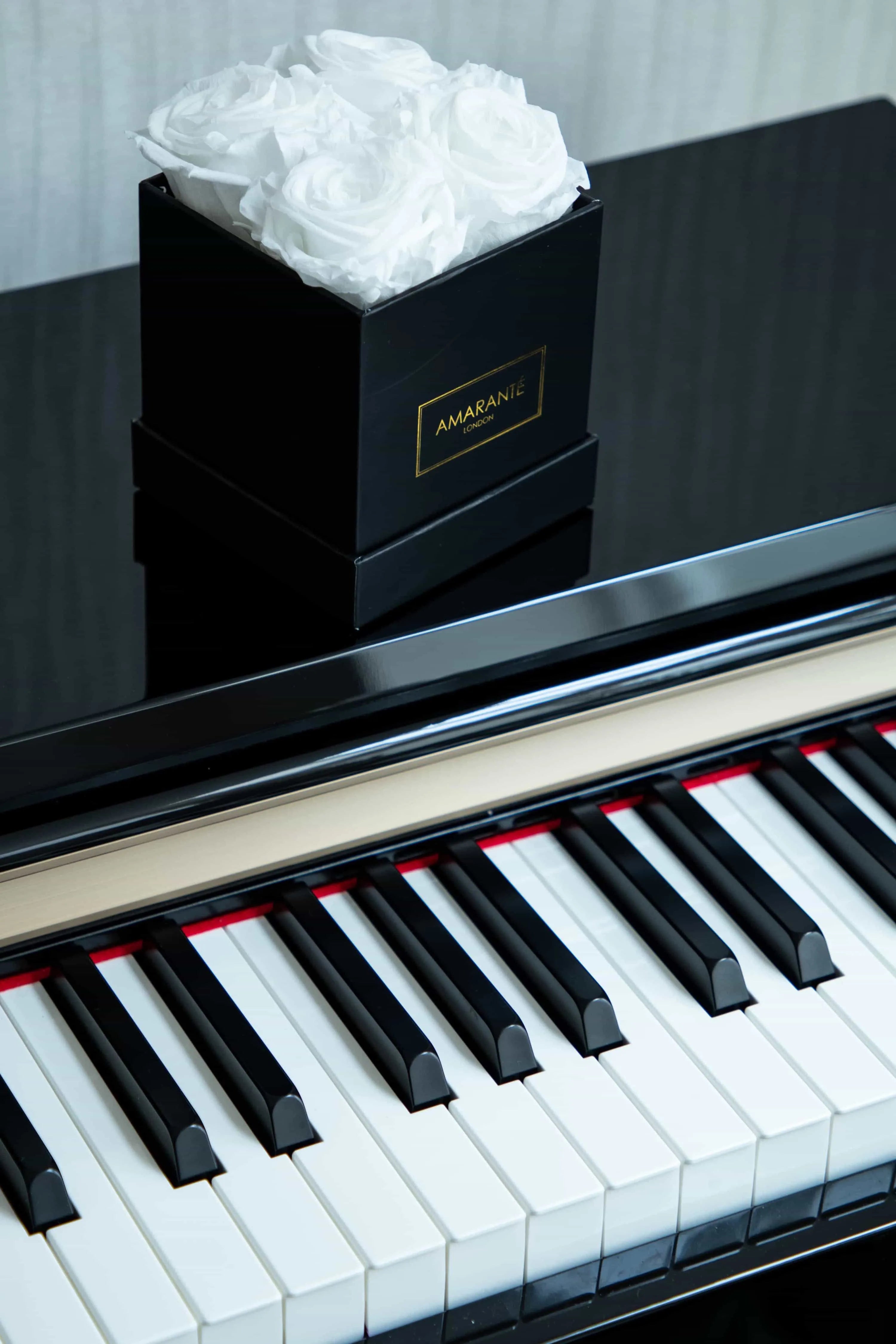 Congratulate an achievement with elegant white infinity roses in a black matte rose box - A thoughtful gift to celebrate success