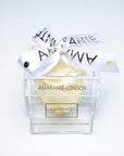 Sophisticated champagne single rose in acrylic rose box decorated with elegant white ribbon - the ideal gift for Valentine's Day and other memorable romantic events in you life.