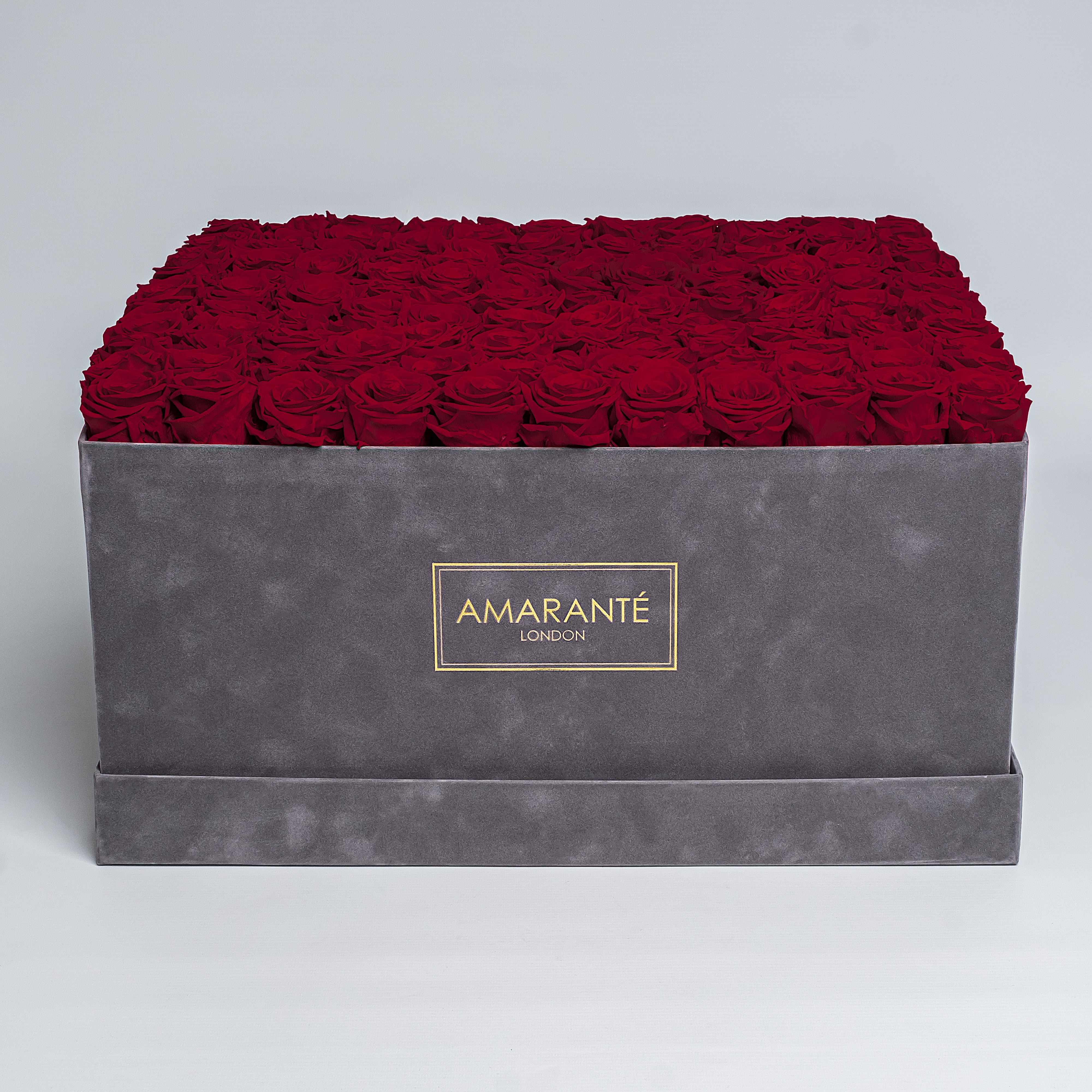 Super deluxe grey square hatbox with 150 deep-red infinity roses, offering a touch of elegance and everlasting love. Free UK delivery. Luxurious 20"x20" Rose Box, Roses are customisable in 14 delicate pastel colours.