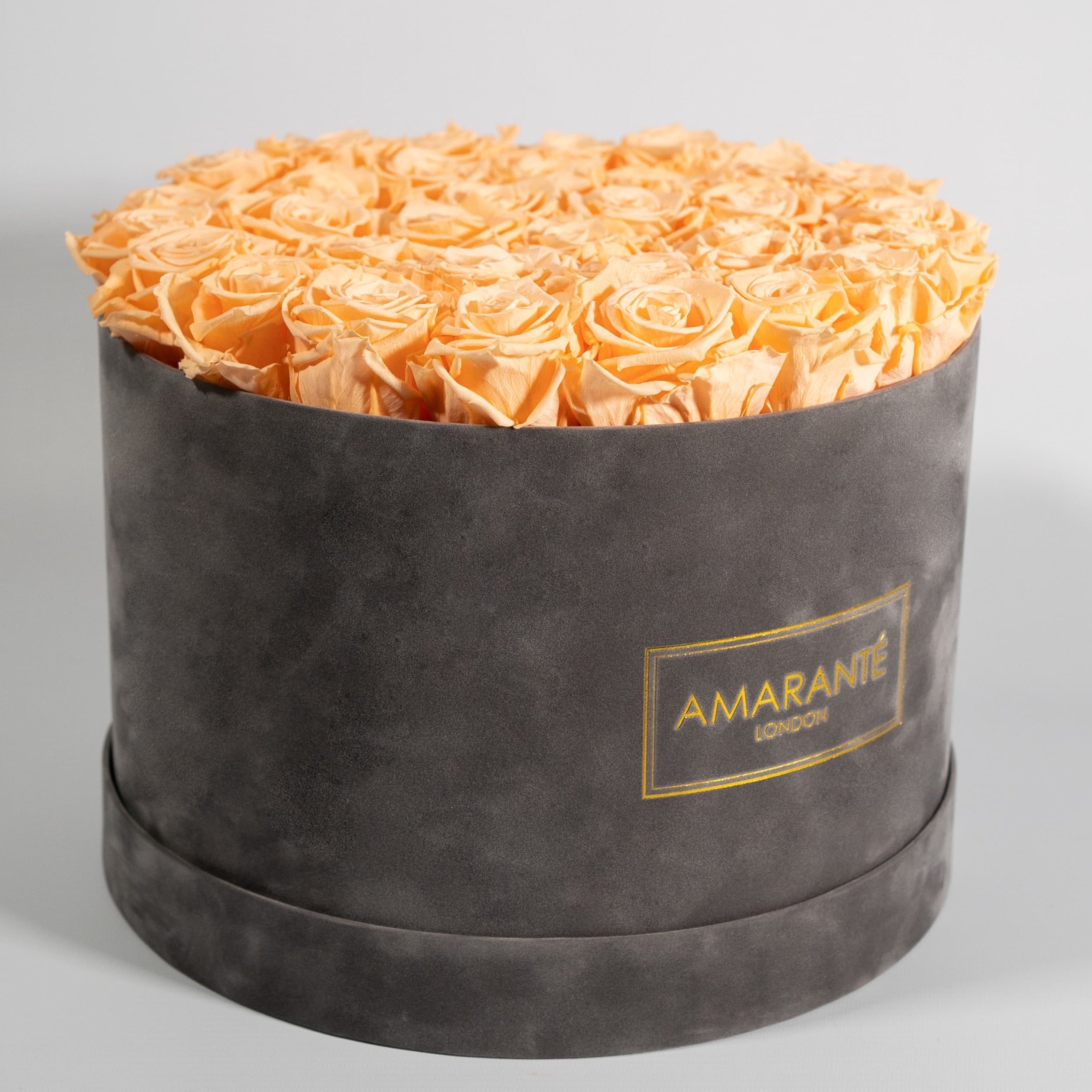 Majestic peach Roses bursting with warm , summer inspired tints.