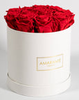 Divine red Roses featured in a dapper white box