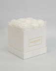 Enchanting white roses featured in a monochromatic white box