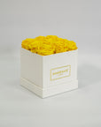 Delightful yellow roses imbedded in a magical white box