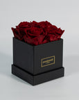 Alluring wine red roses included in a modern black box