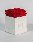 Divine red roses placed in a dapper white box