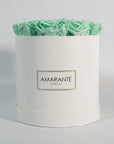 Enchanting mint green roses featured in a gorgeous white medium box