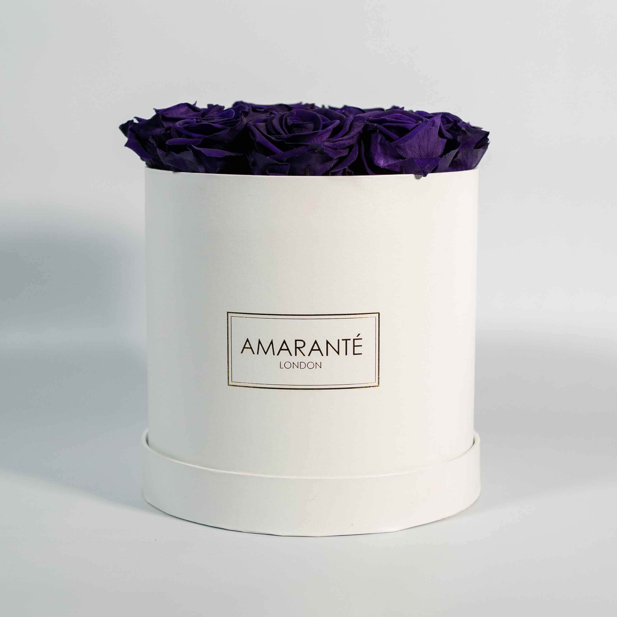 Aromatic dark purple roses denoting wisdom and creativity.
