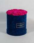 Expressive hot pink Roses shown in a beautiful blue box
