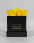 Delightful yellow roses featured in a sleek black box