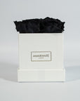 Bold black roses entrenched in a stunning white box