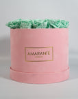 Revitalising mint green Roses featured in a delicate pink box
