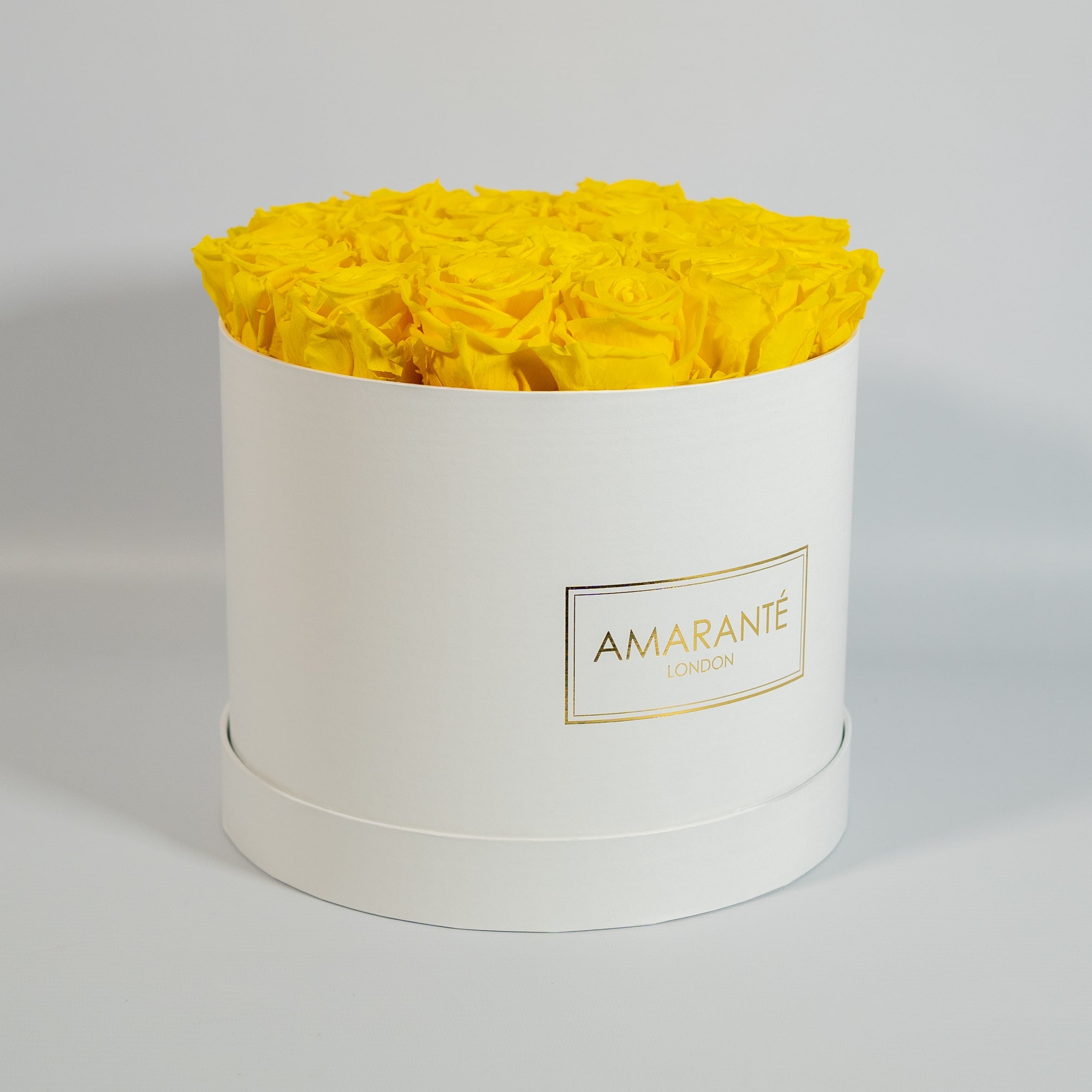 Delightful yellow Roses exhibited in an elegant white large box