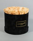 Tranquilising peach Roses in a sleek black box