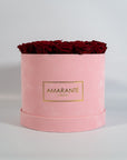 Divine wine Red Roses imbedded in a trendy pink box