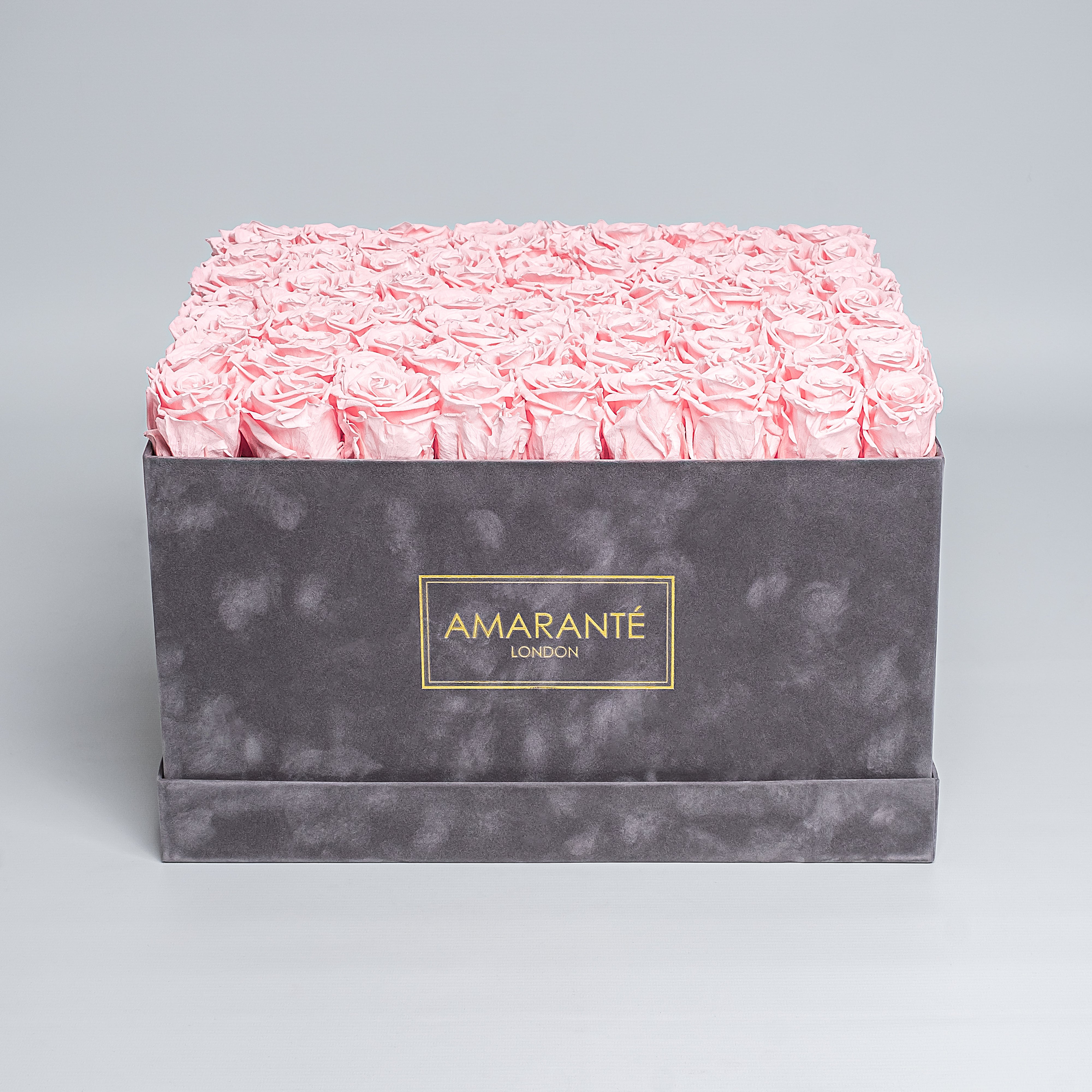 Experience elegance with our 16"x16" extra large grey hatbox, filled with large light-pink forever roses. A luxurious gift of love with free UK delivery, roses customisable in 14 pastel tones.