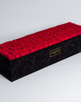 Sophisticated super deluxe black rectangular suede rose box, elegantly filled with 140 pink infinity roses, epitome of timeless love. Free UK delivery, 30"x25", luxury rose box customisable with roses in 14 delicate pastel shades.