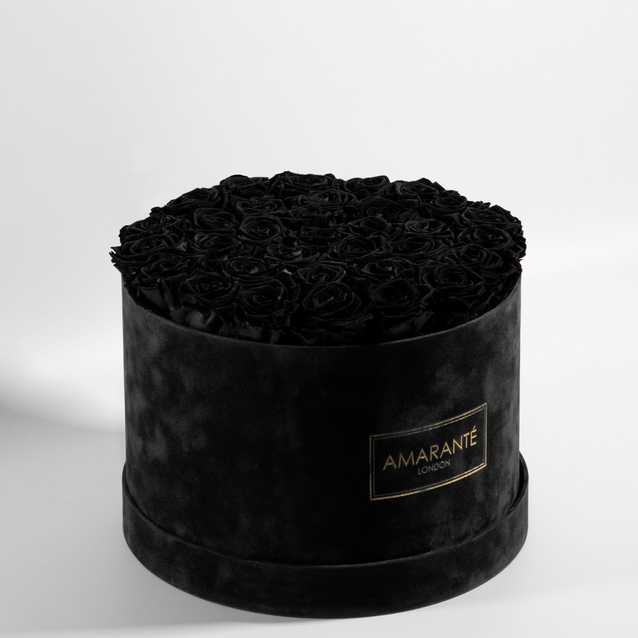 Monochromatic black Roses in a dapper black extra large box, ideal for saying sorry.