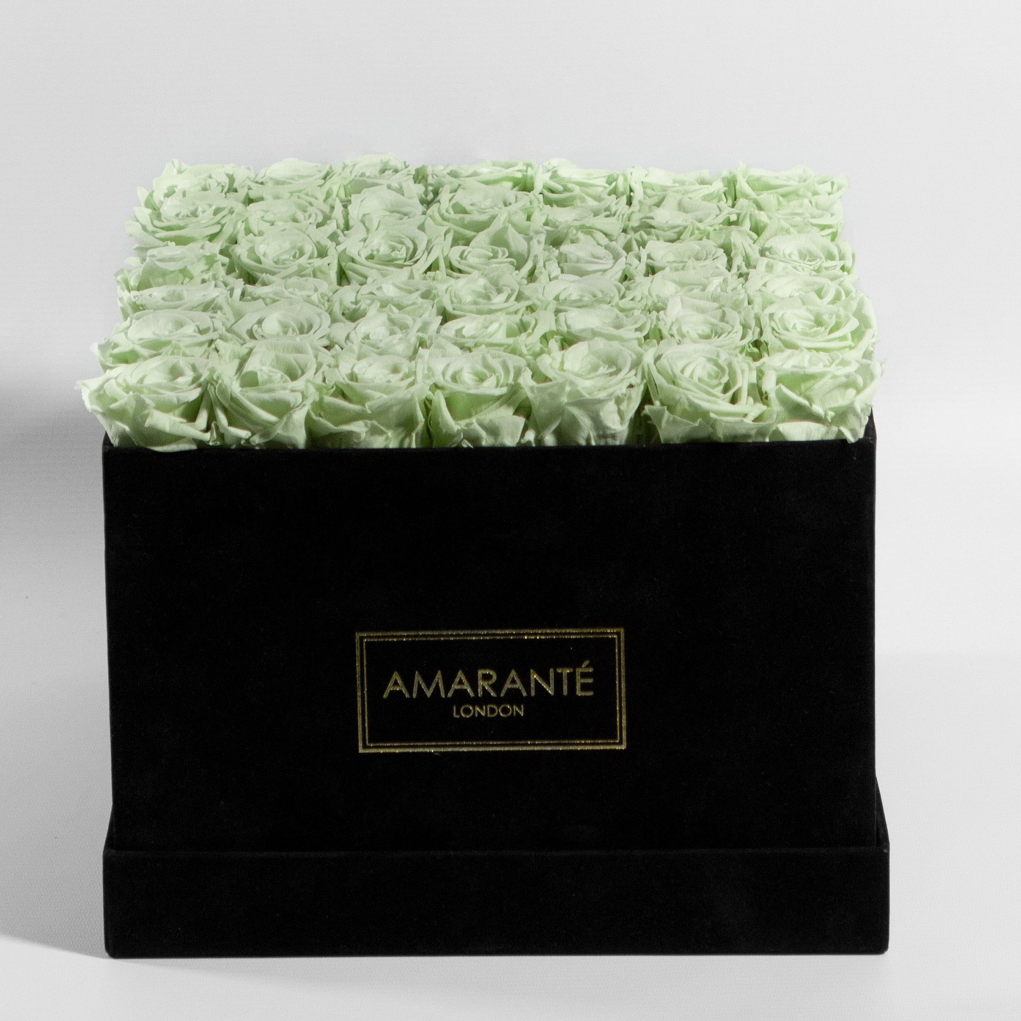 Refined taste of a timeless gift - 36 large mint green infinity roses in a stylish black suede rose box. Free UK Delivery.