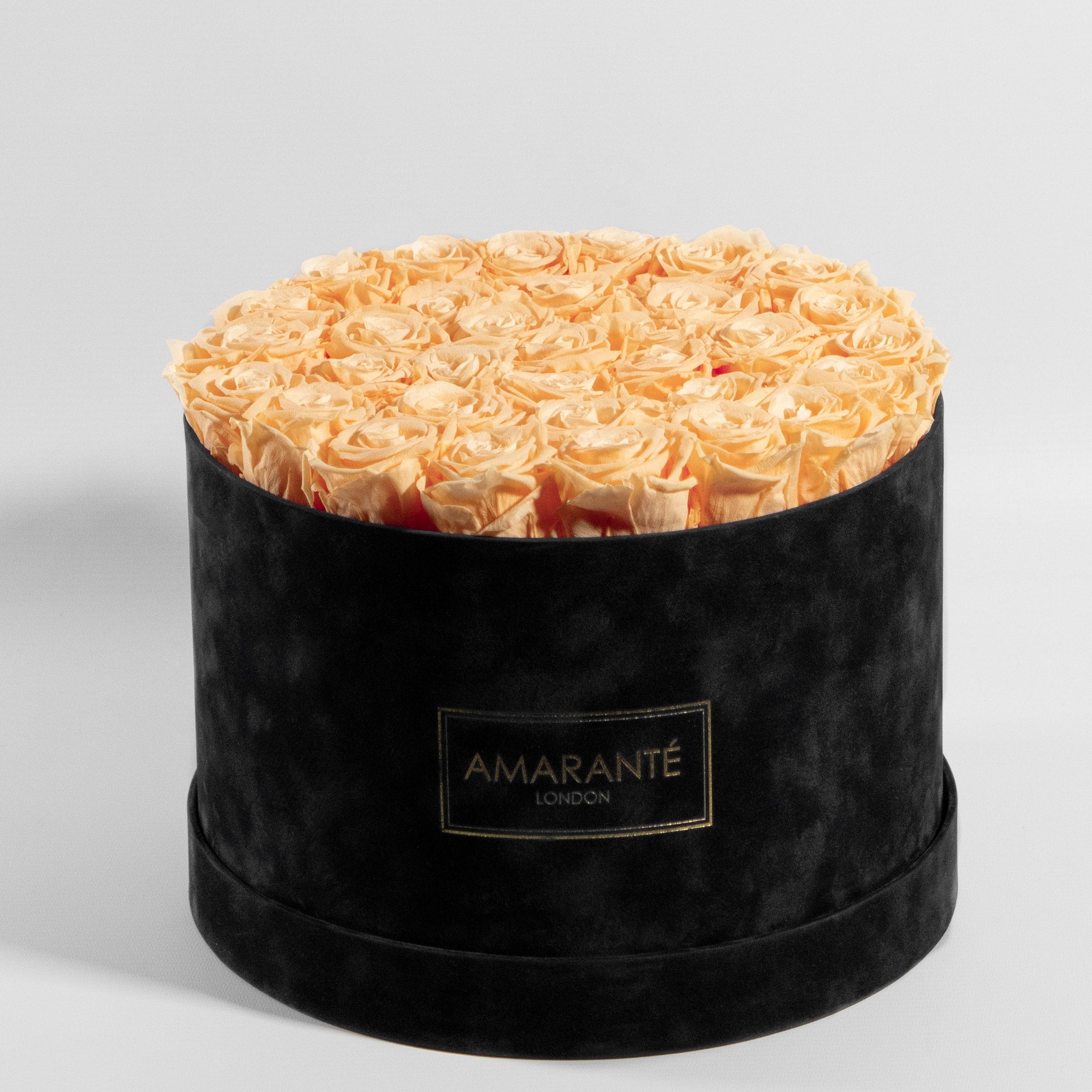 Majestic peach Roses in a stylish black box, ideal for expressing friendship and adventure.