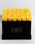 36 Mesmerising yellow forever roses neatly arranged in an elegant square suede rose box. Free UK Delivery.