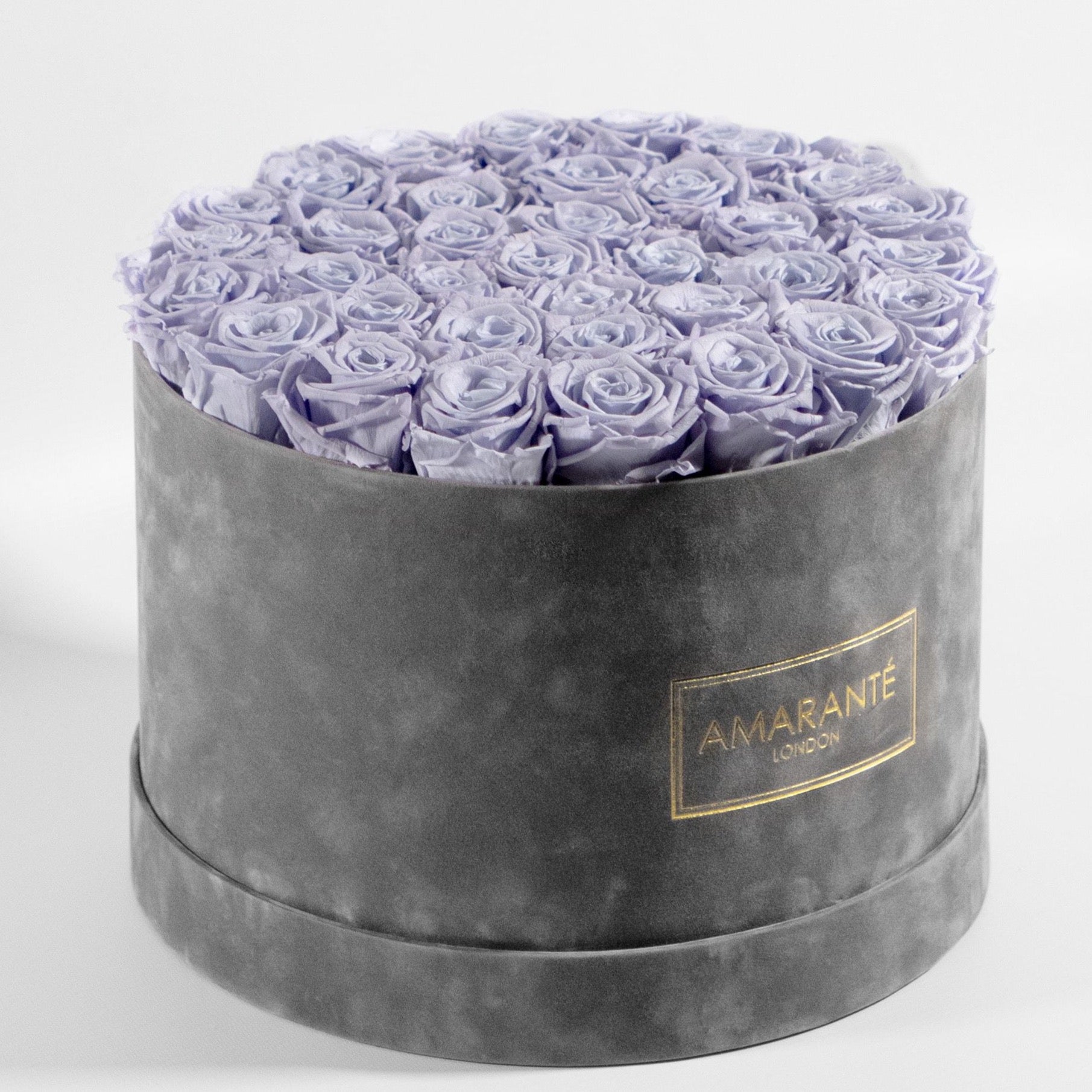 Captivating Lavender Roses accessible in a stylish grey box