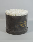 Abloom white Roses featured in a fashionable grey box