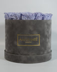 Fragrant lavender Roses encompassed in a modern grey box in round and large size