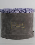 Spring-time inspired Lavender Roses imbedded in a stunning grey package.