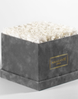 Heart-warming white Roses imbedded in a chic grey box