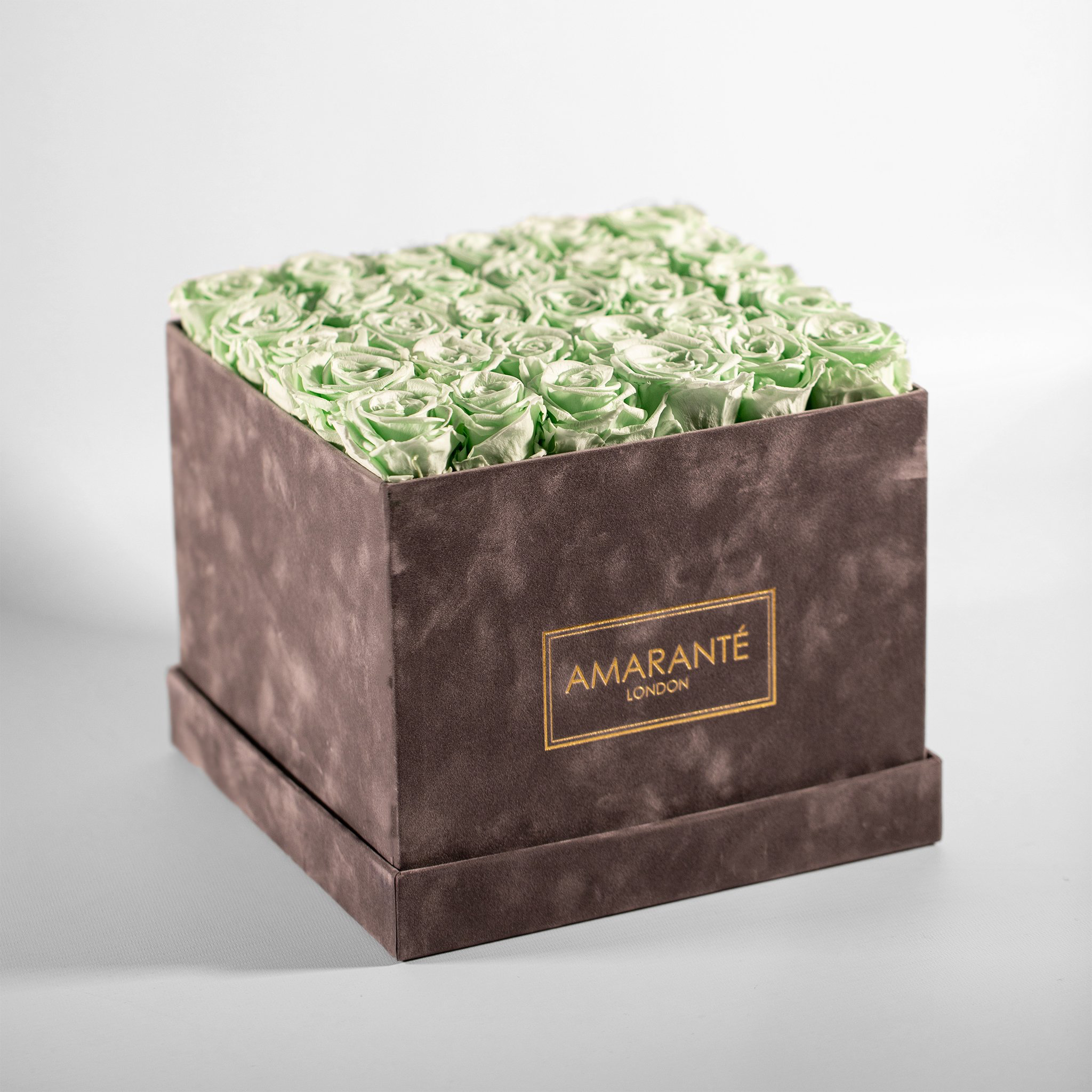 Revitalising mint green Roses, denoting energy and good health.