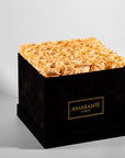 Tranquilising peach Roses featured in a divine black box, connoting joy and warmth.