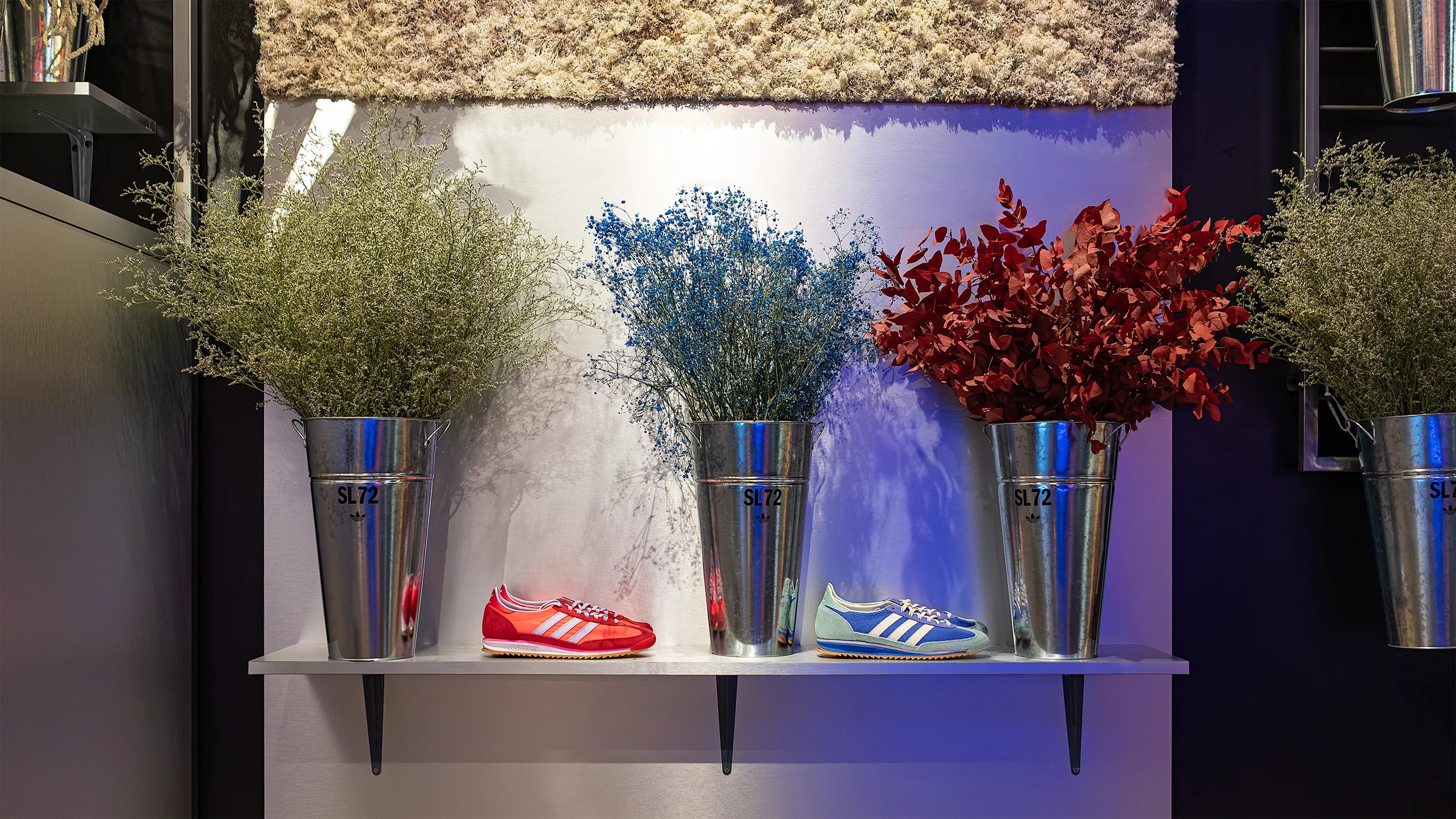 Floral ceiling installation by Amaranté London at The Adidas Oxford Street Store SL72 collection launch, featuring a mix of preserved flowers in red, white, and blue which are the Adidas Brand colours - Amaranté London, Event Florist