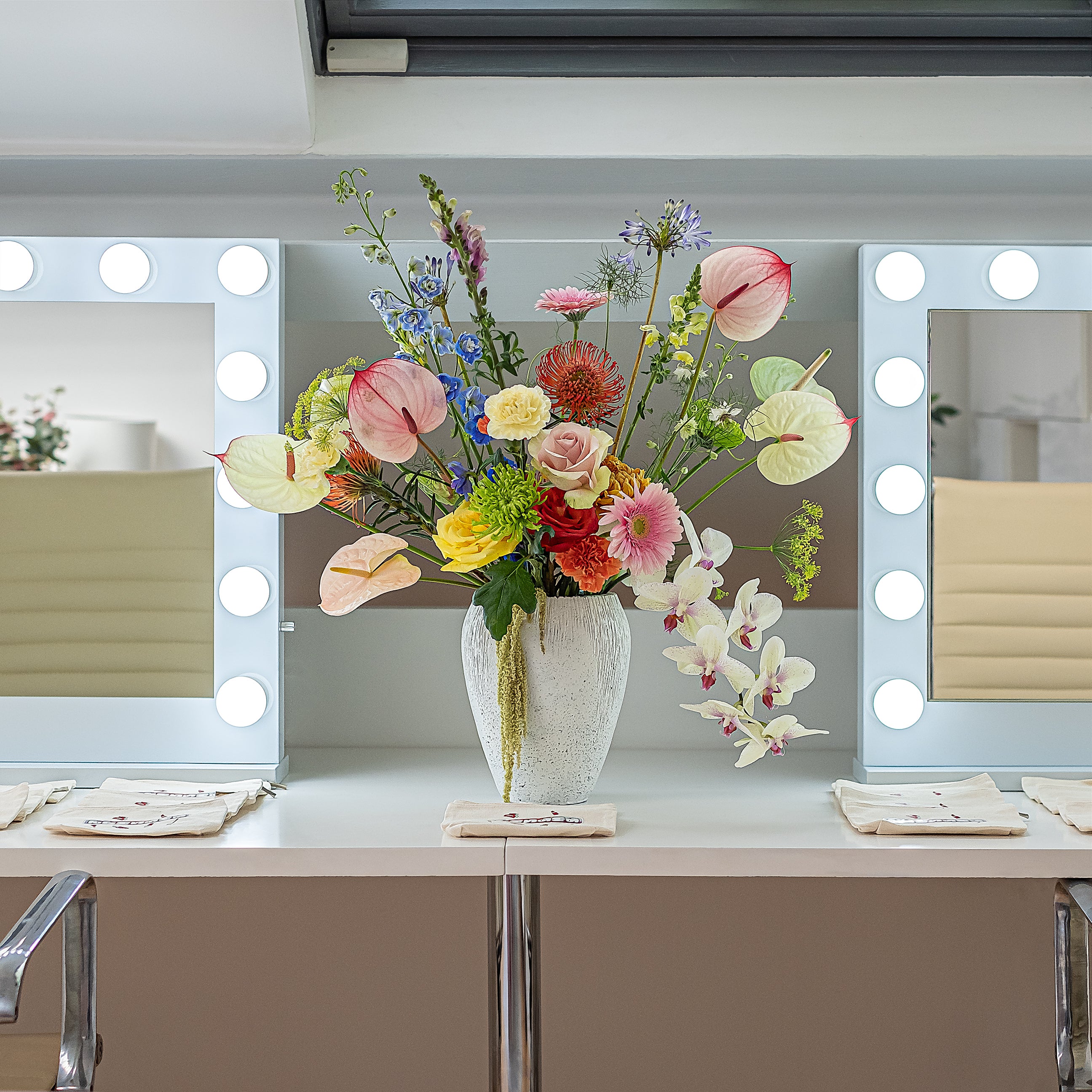 A beautiful, colourful floral vase arrangement created by event florist Amaranté London for a client for an influencer event.