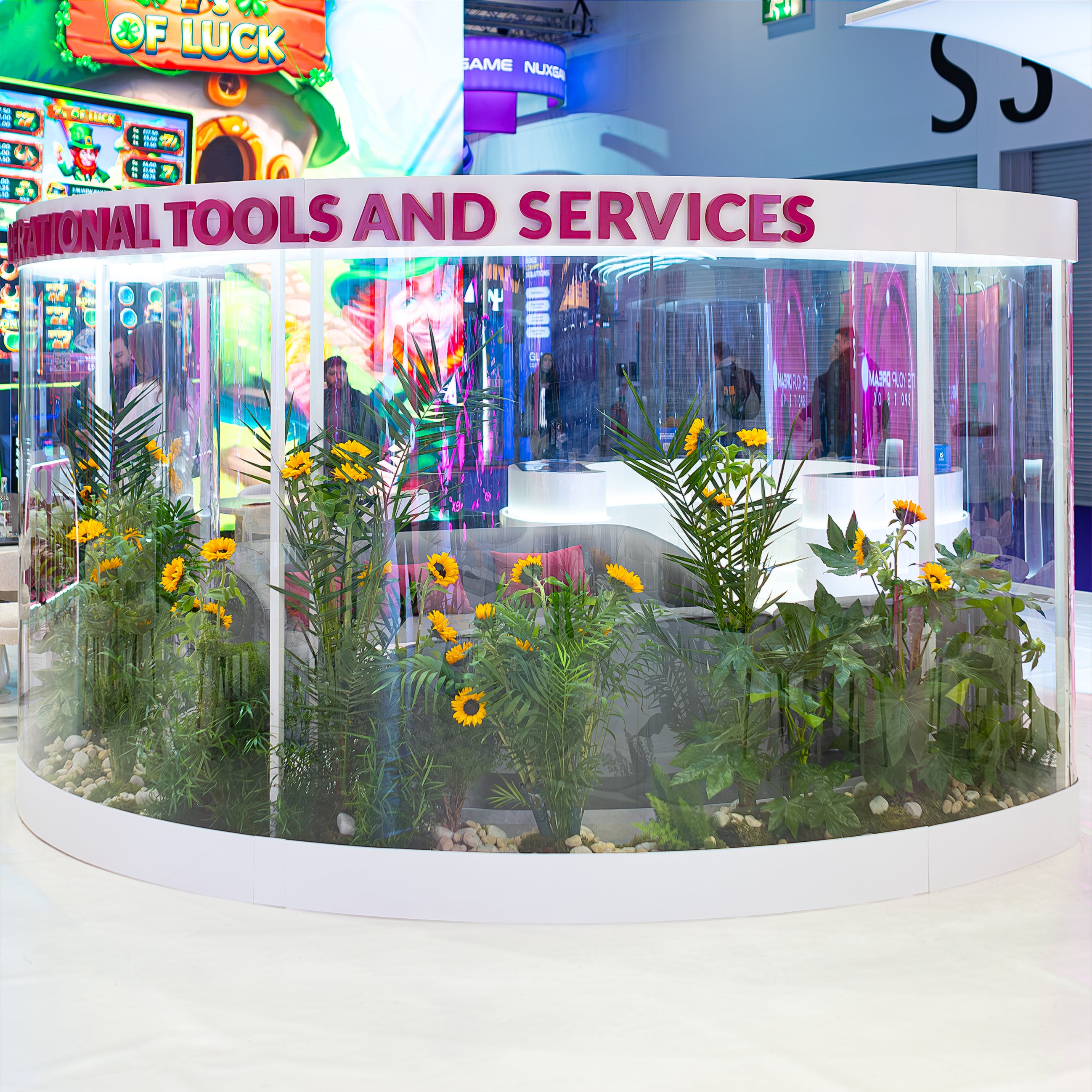 Stunning sunflowers and green foliage in a sophisticated glass floral display at The ICE London Exhibition, Vibrant Corporate Event in London.