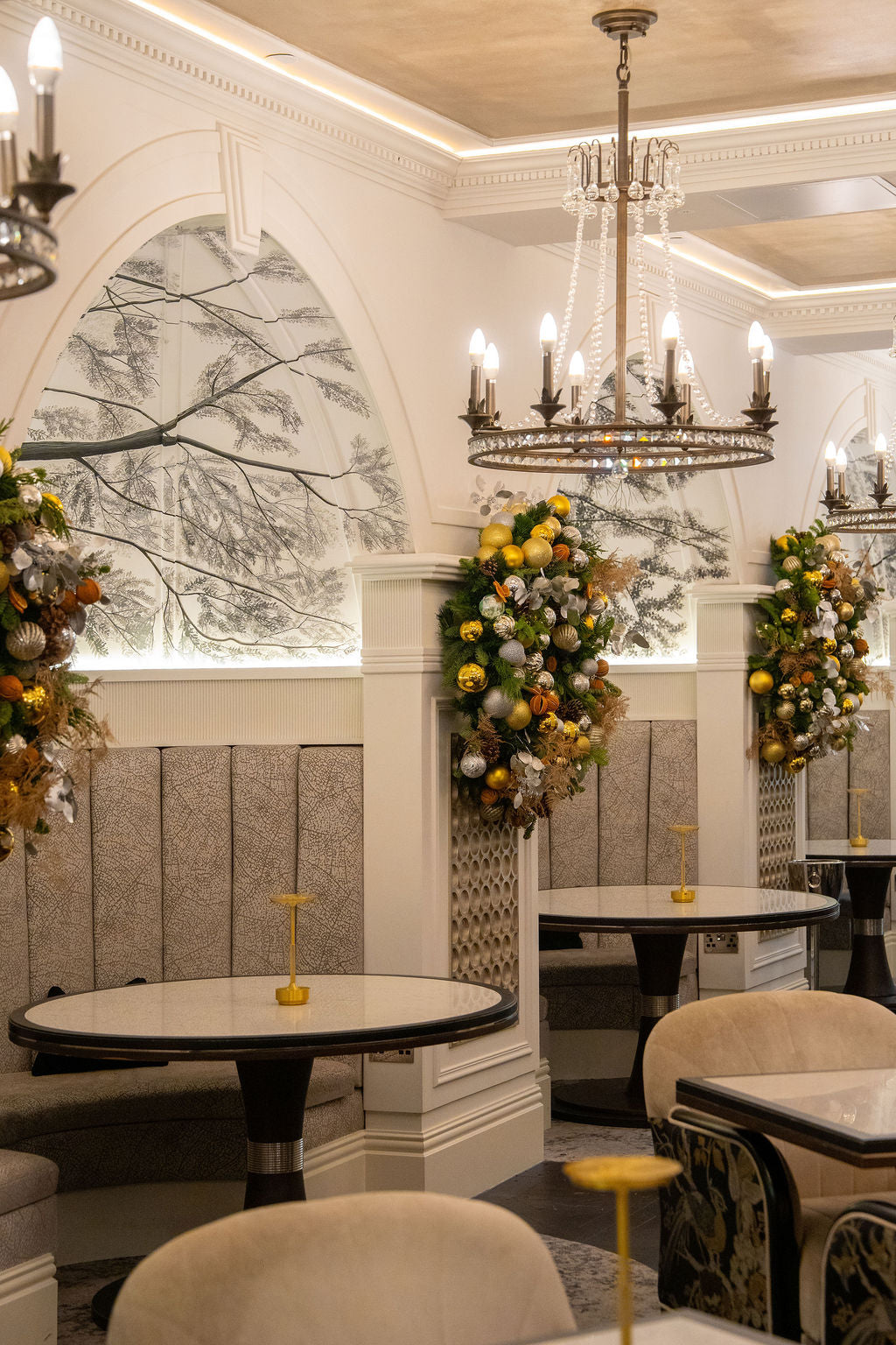 Festive Christmas garland installations with gold, silver and botanical detailing, designed for Fairmont Windsor Park restaurant by Amarante London