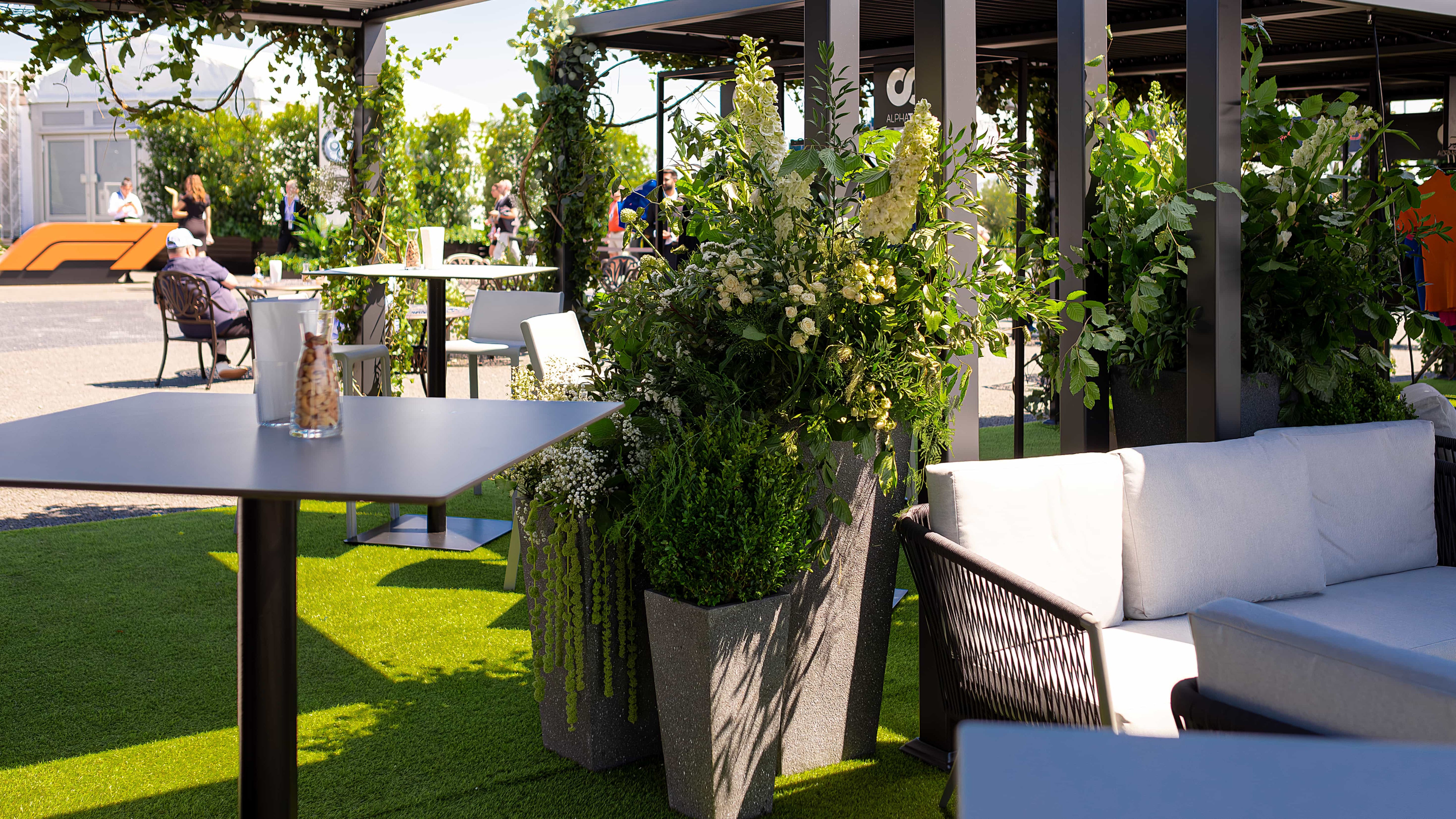 Bespoke plant installations by event florist Amaranté London, enhancing the natural beauty at Formula 1's Silverstone event.