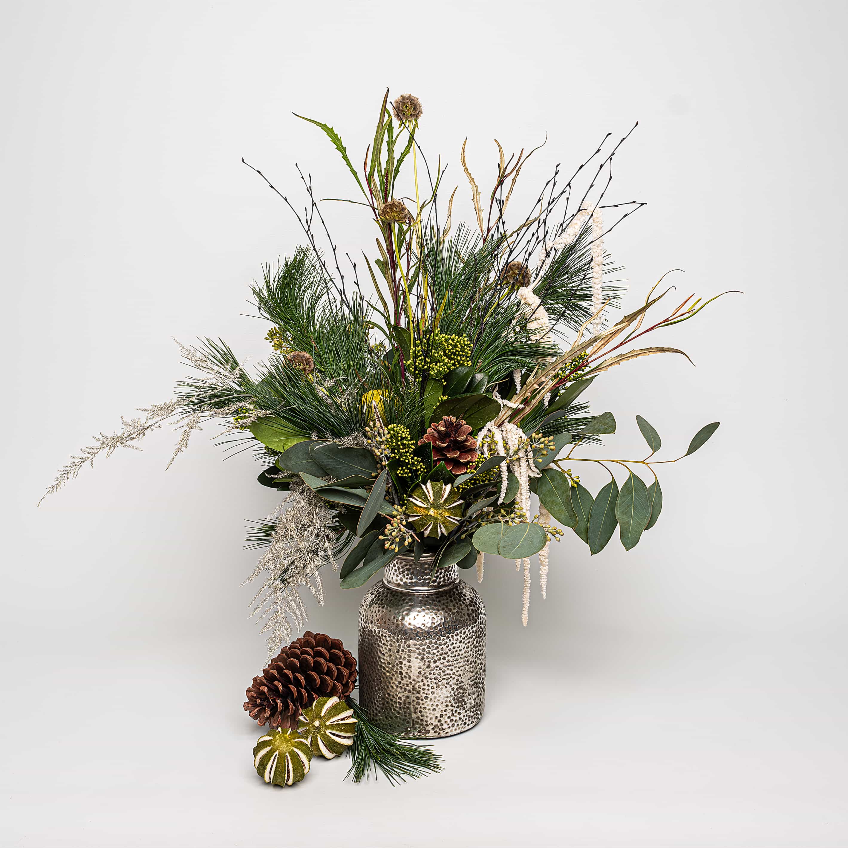 Medium Götenberg Christmas Bouquet: vibrant whites, deep greens, and the rustic elegance of pine cones - Amaranté London 