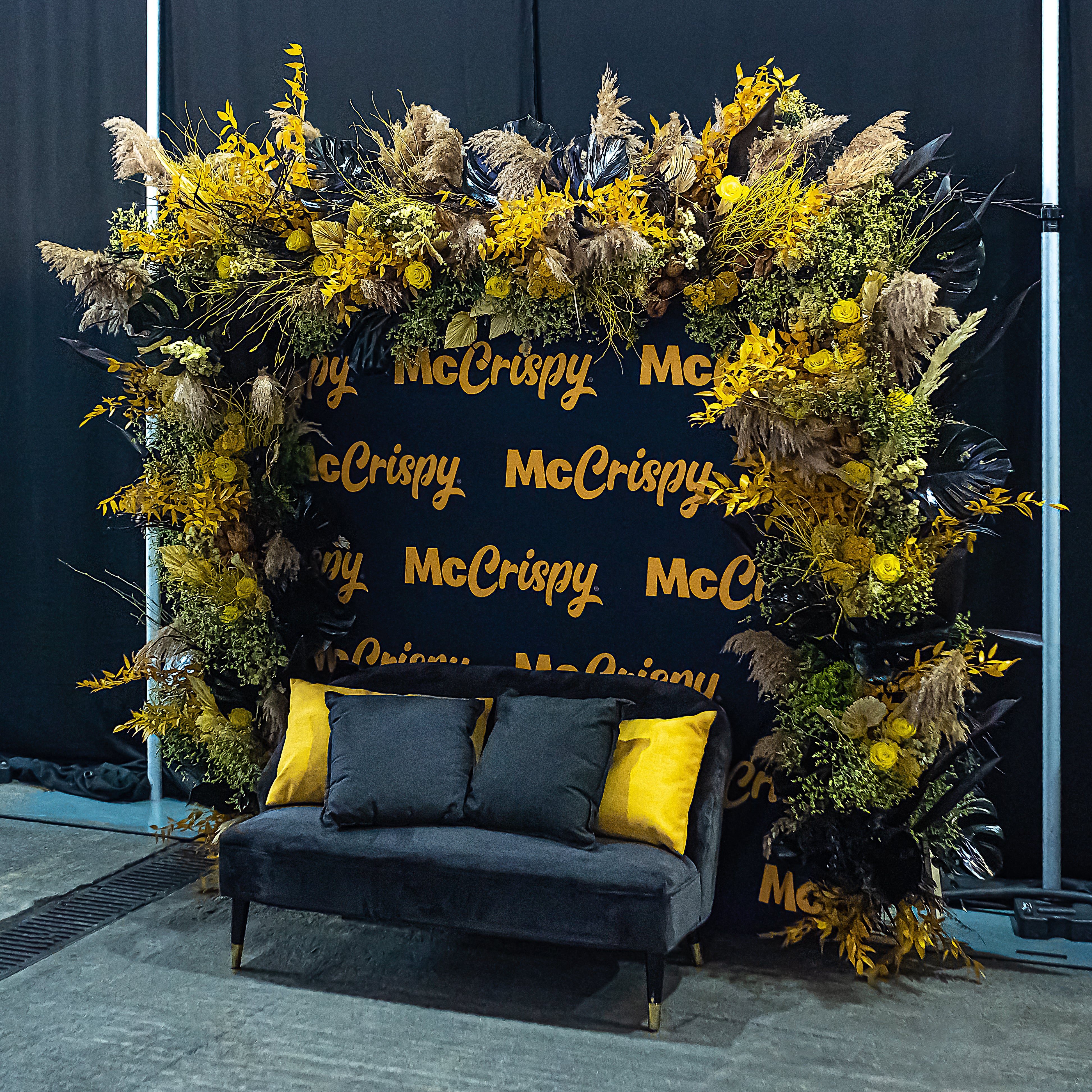 Curated using their signature brand colours, event florist Amaranté London brought together sustainable stems to make a floral arch installation for McDonalds.