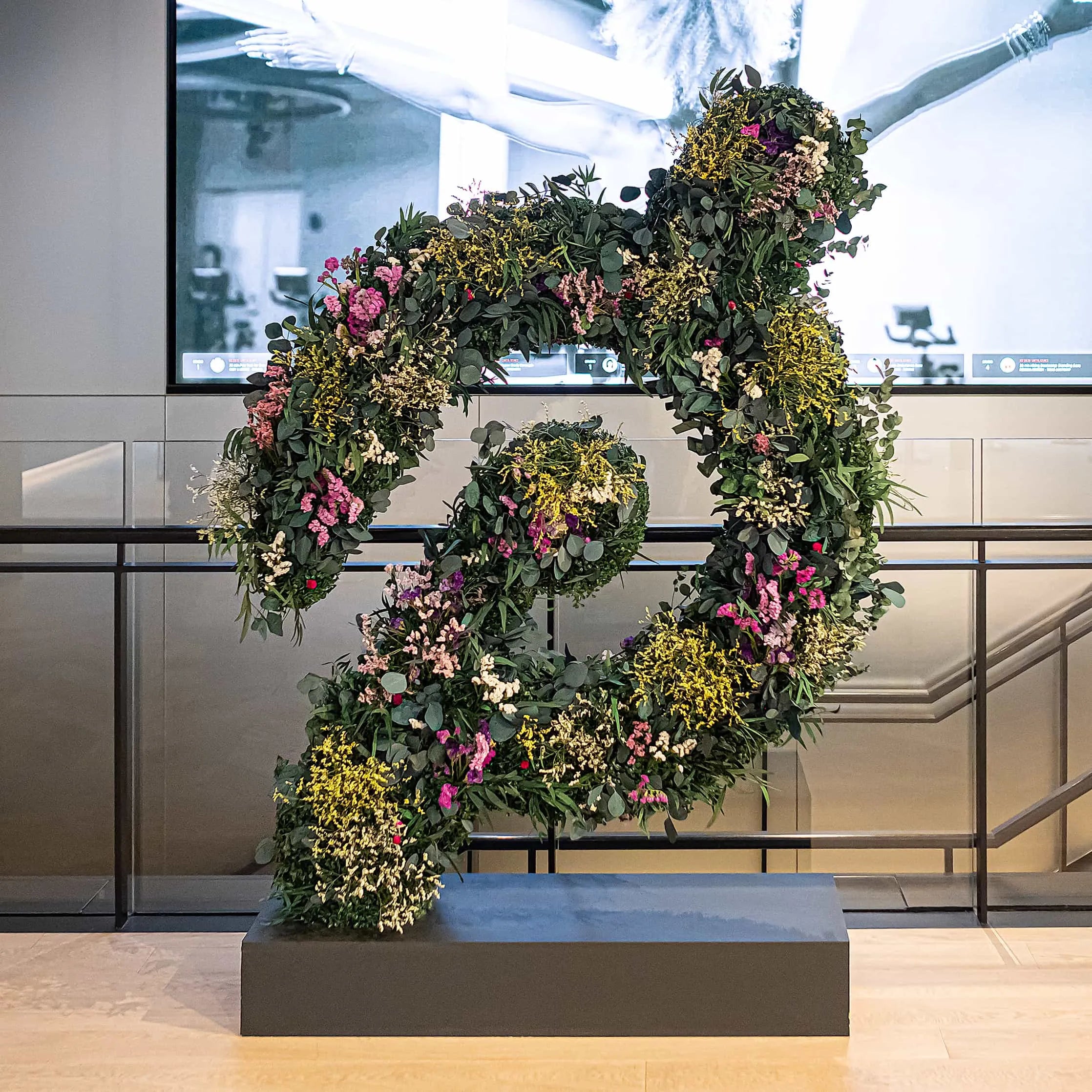For Peloton we created a bespoke floral installation made in the shape of their distinctive logo, using only sustainable fresh and forever flowers