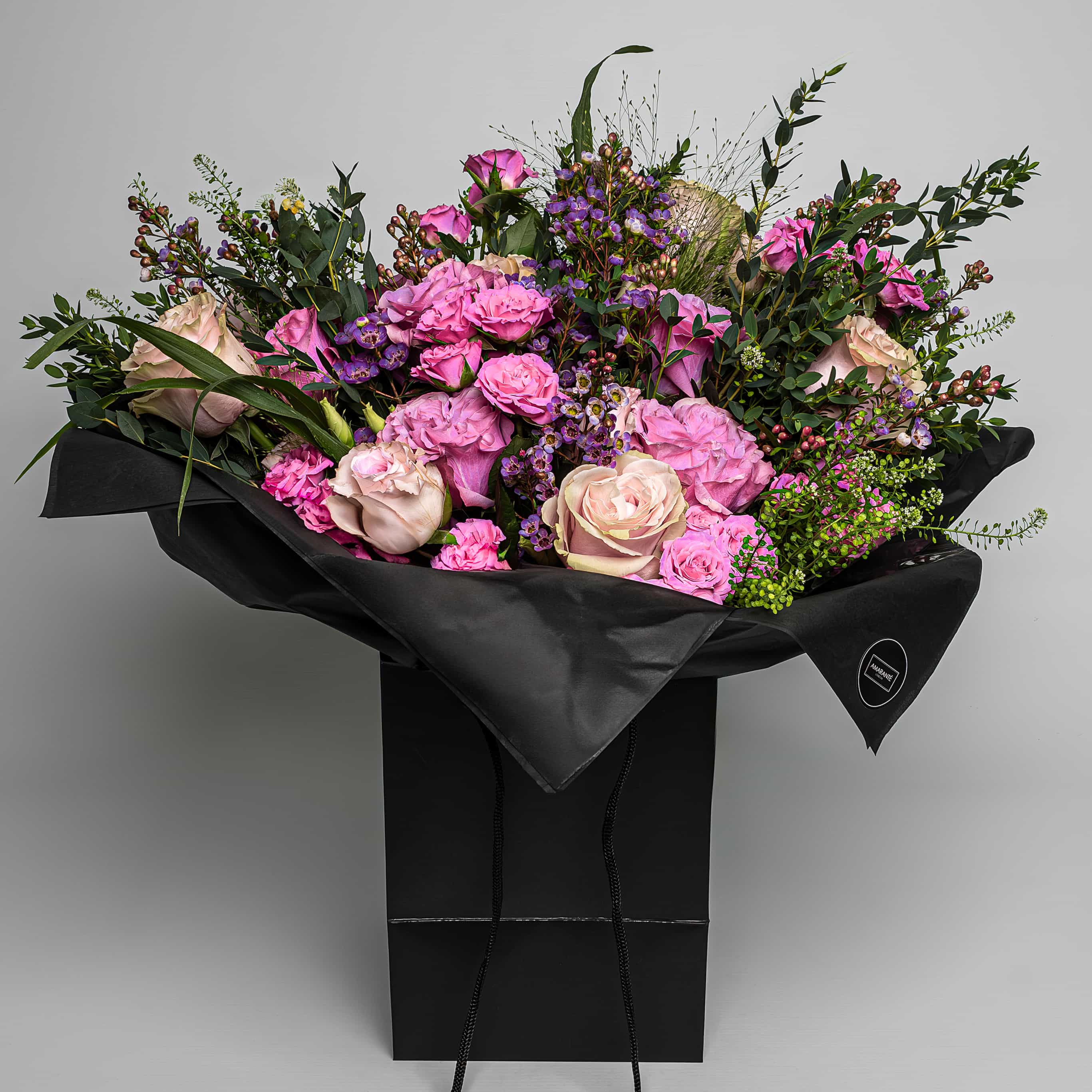 Exquisite Valentine&#39;s Day Bouquet of fresh, vibrant pink roses artfully arranged with stems and lavish green leaves. Convey your affection with this sophisticated, luxury bouquet boasting timeless elegance. Perfect for mesmerising your loved one this Vday. Free UK Delivery. Image source: Amarante London.