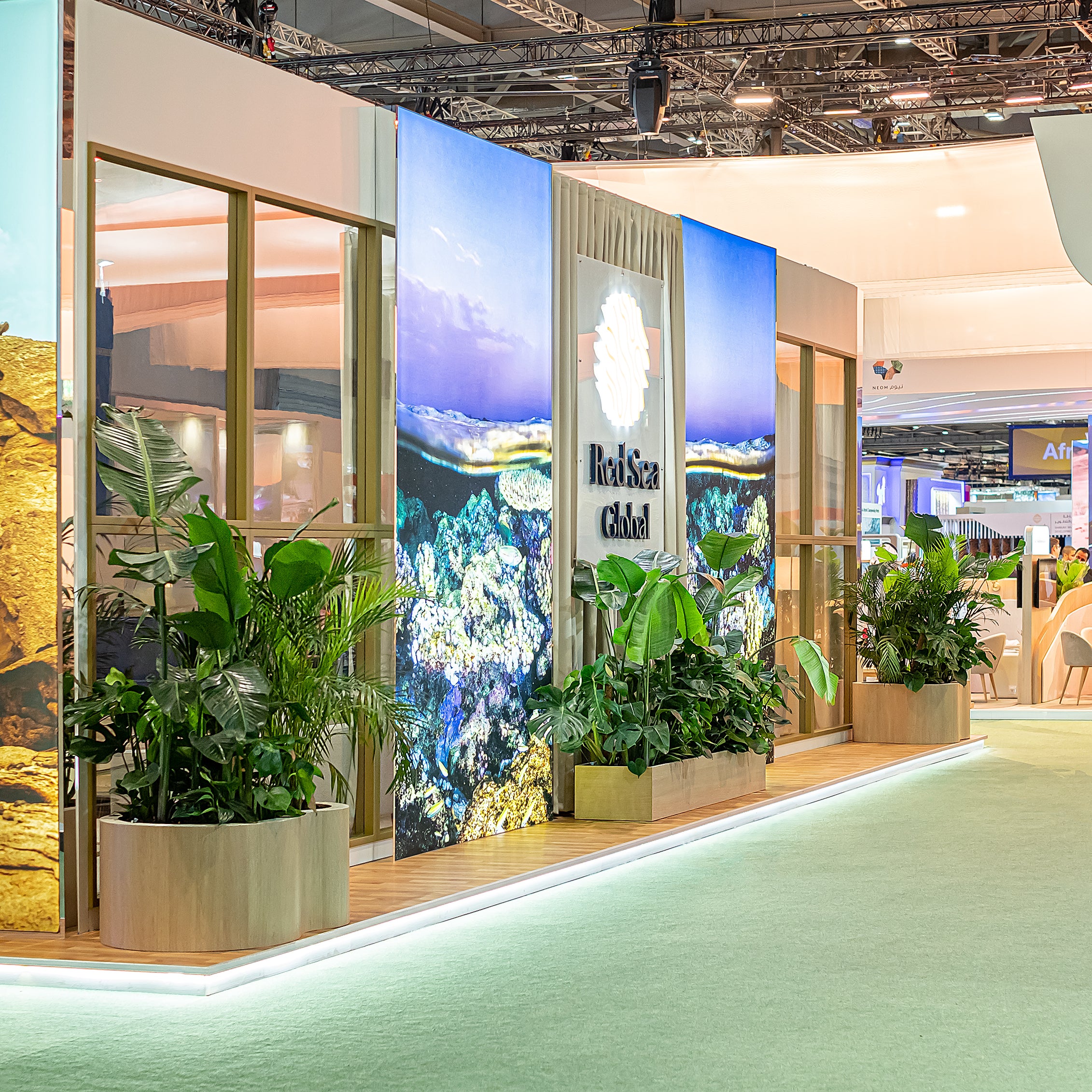 A panoramic view of an exquisite plant arrangement at the WTM London for Red Sea Global, designed, created and installed by Amaranté London - Event Florist in London