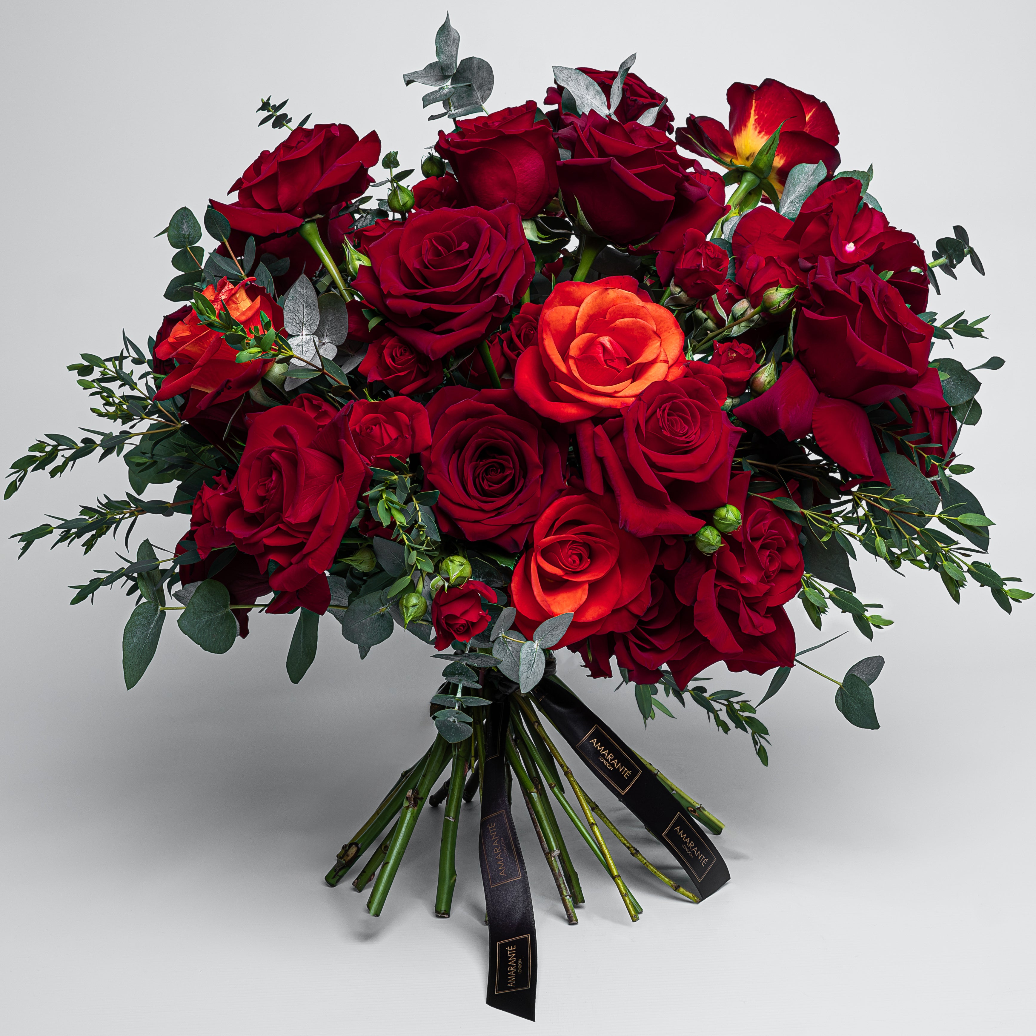 A captivating fresh flower Valentine&#39;s Day bouquet showcasing exquisite arrangements of elegant red roses in vibrant shades, perfectly symbolising love and affection. This sophisticated and refined bouquet exudes a timeless sense of elegance and grace, perfectly designed for a stylish and classy Vday gesture. This polished and luxurious bouquet of roses, available with free UK delivery, is the ideal sophisticated representation of your chic and trendy affection.