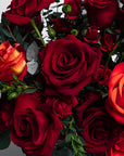 Close up view of this luxurious bouquet of fresh red roses for Valentine's Day, elegantly arranged to express love and affection. Features exquisite roses in polished shades of red, embracing the spirit of this special day. Gracefully combined with chic and sophisticated foliage, this stylish, timeless bouquet adds a touch of class to this romantic occasion, providing a refined and trendy choice for Vday. Enjoy free UK delivery on all our fresh flower bouquets.