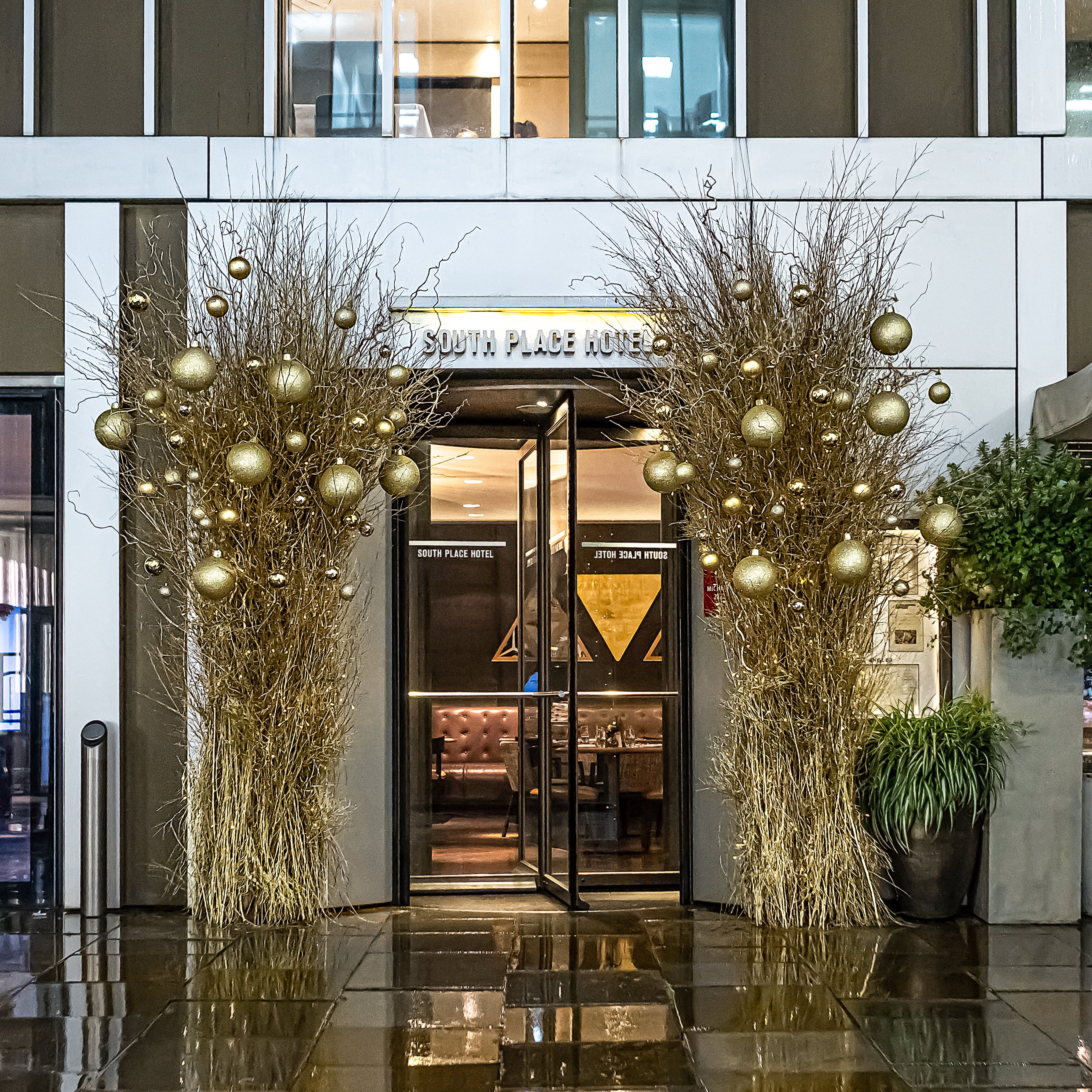 Outdoor floral arrangement as a part of South Place Hotel’s Christmas décor transformation - Amaranté London Event Florist