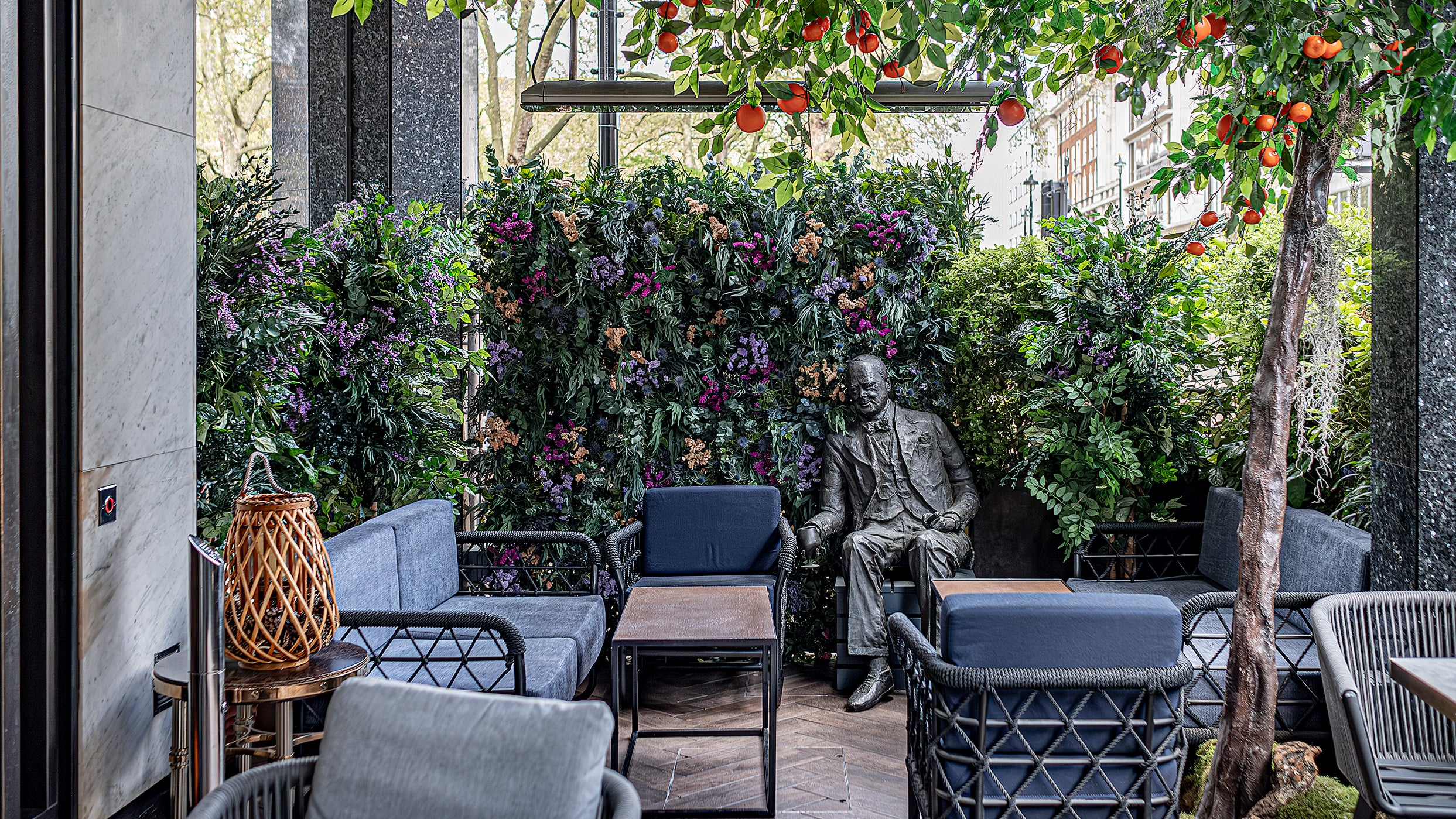 Bespoke floral summer terrace design from event florist Amaranté London, using only naturally preserved stems that last. 
