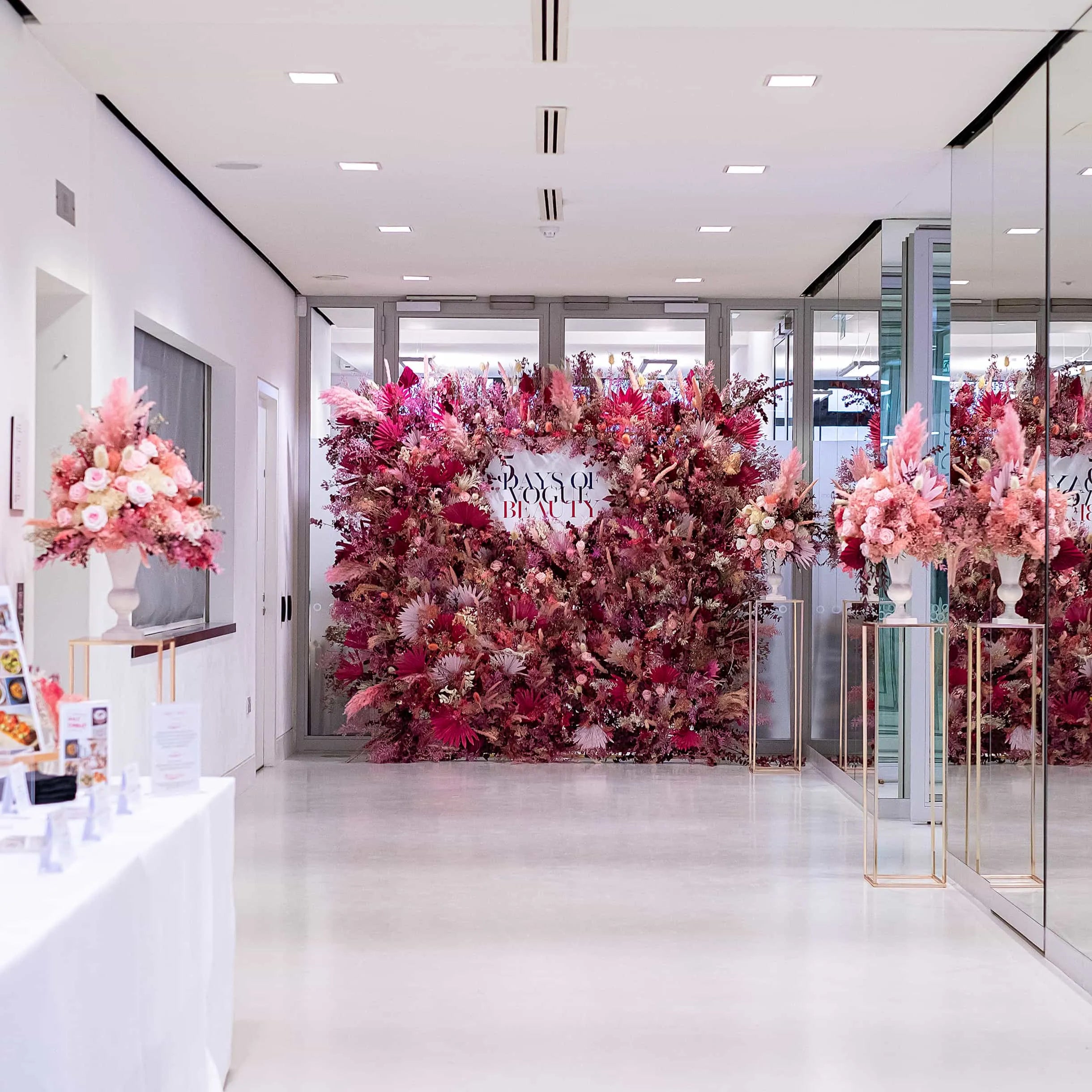 Blushing sustainable pink stems are brought together in this stunning flower wall by event florist Amaranté London for Vogue’s 5 Days of Beauty event