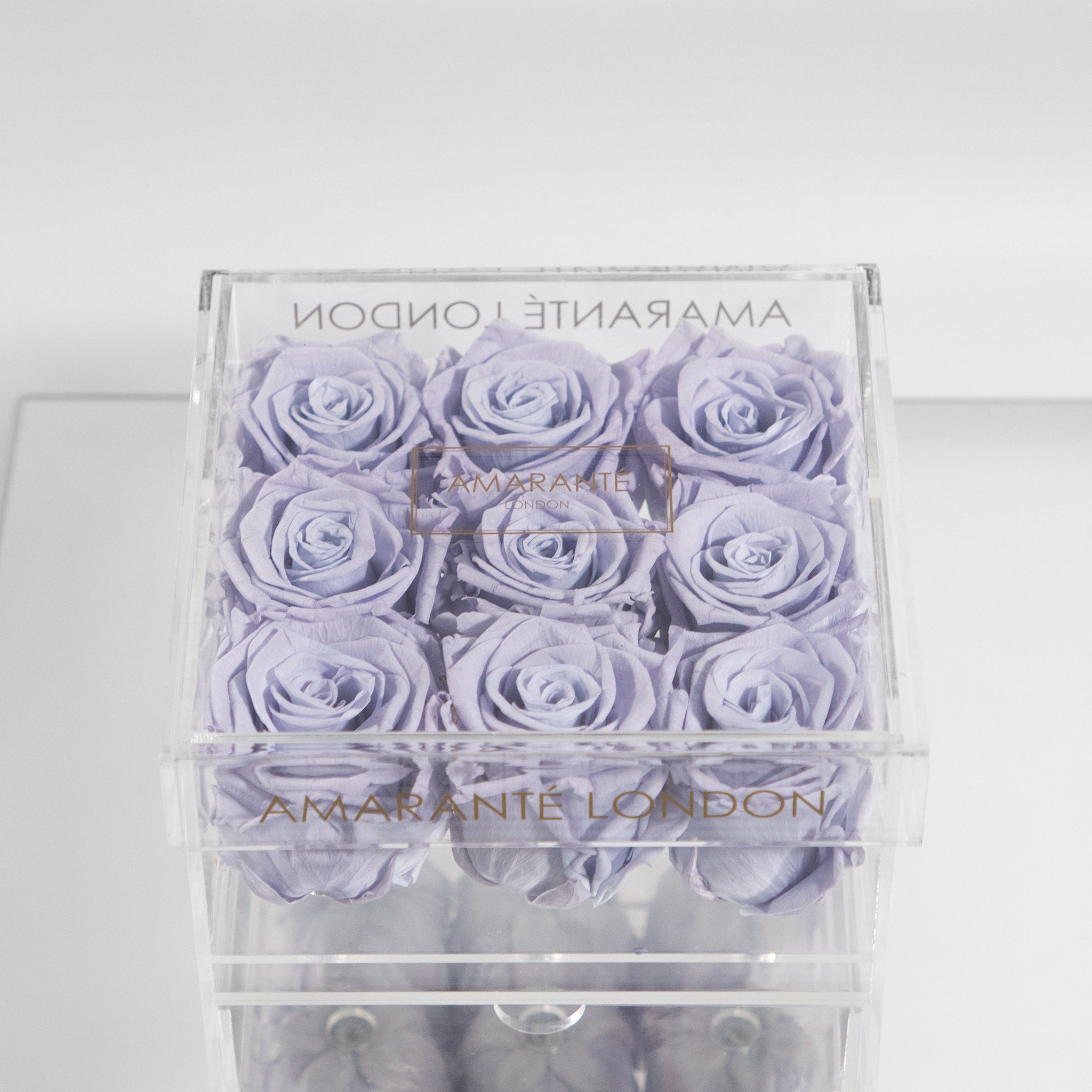 Distinctive lavender Roses in  medium assortment of nine Roses